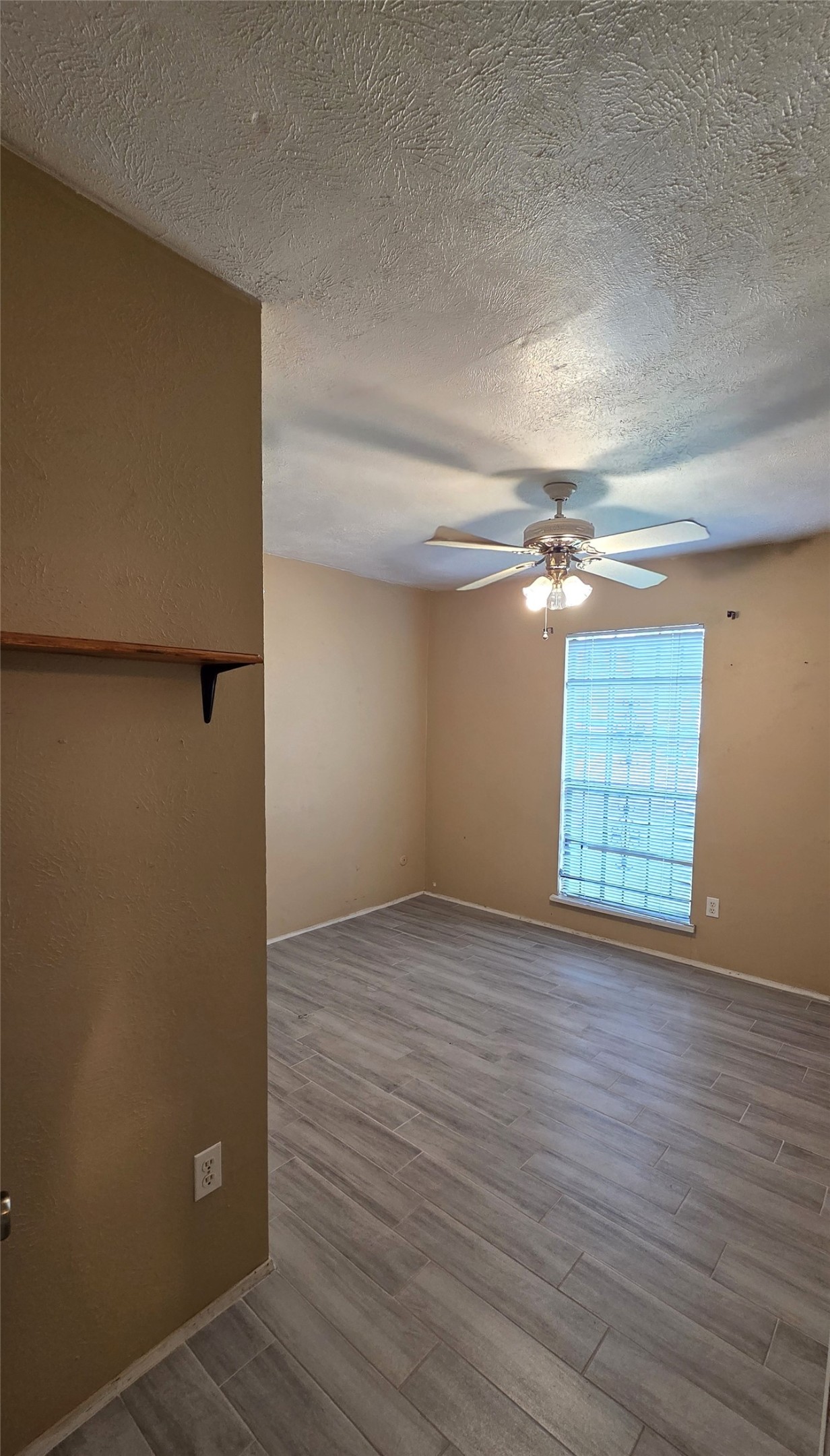 14110 Pinewest Drive Houston, TX 77049 - Photo 17 of 26 a view of empty room with wooden floor