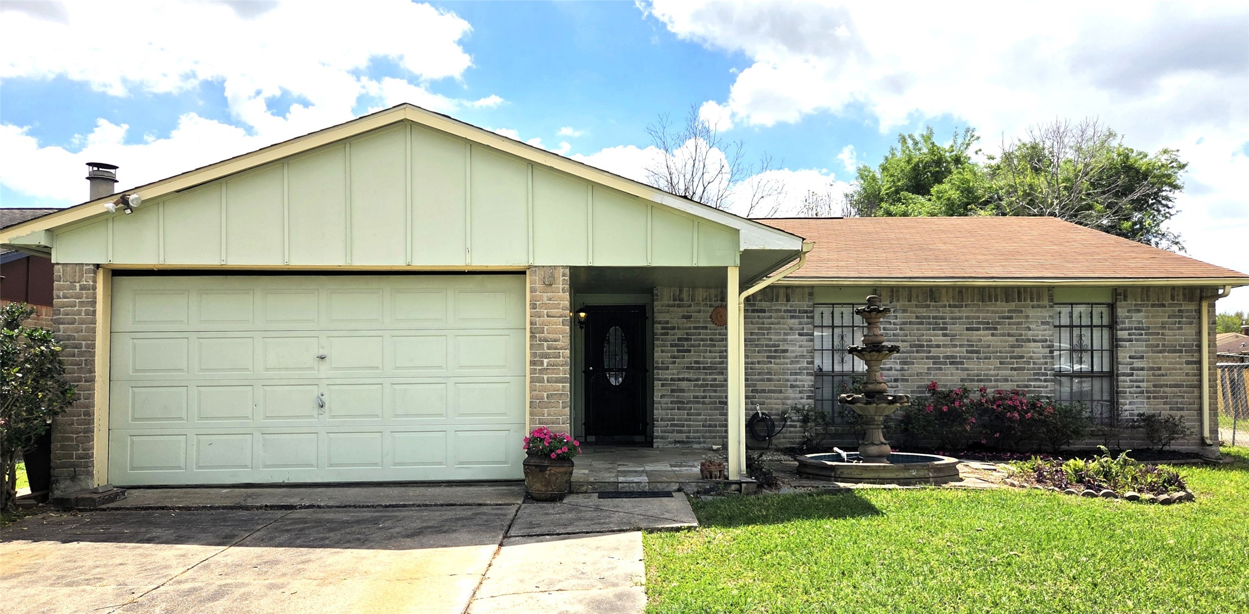14110 Pinewest Drive Houston, TX 77049 - Photo 2 of 26 a view of a small house with yard