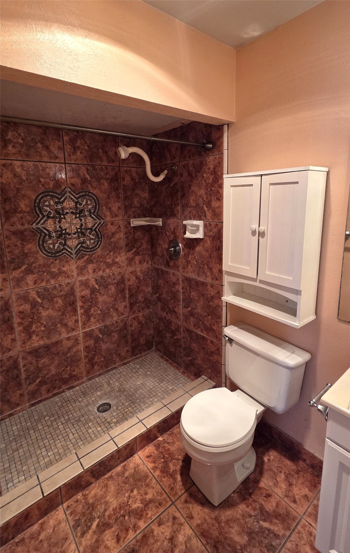 14110 Pinewest Drive Houston, TX 77049 - Photo 24 of 26 a bathroom with a toilet and a shower