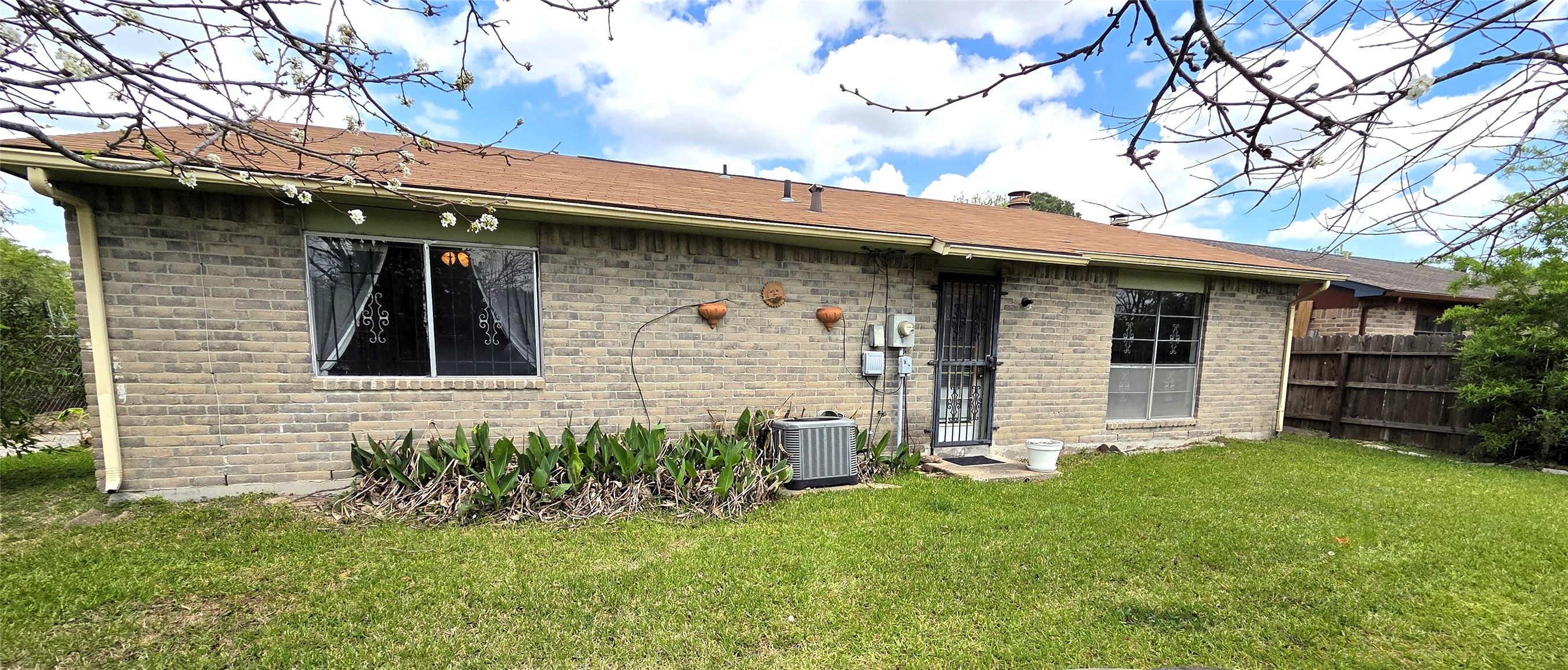 14110 Pinewest Drive Houston, TX 77049 - Photo 3 of 26 a front view of a house with a yard