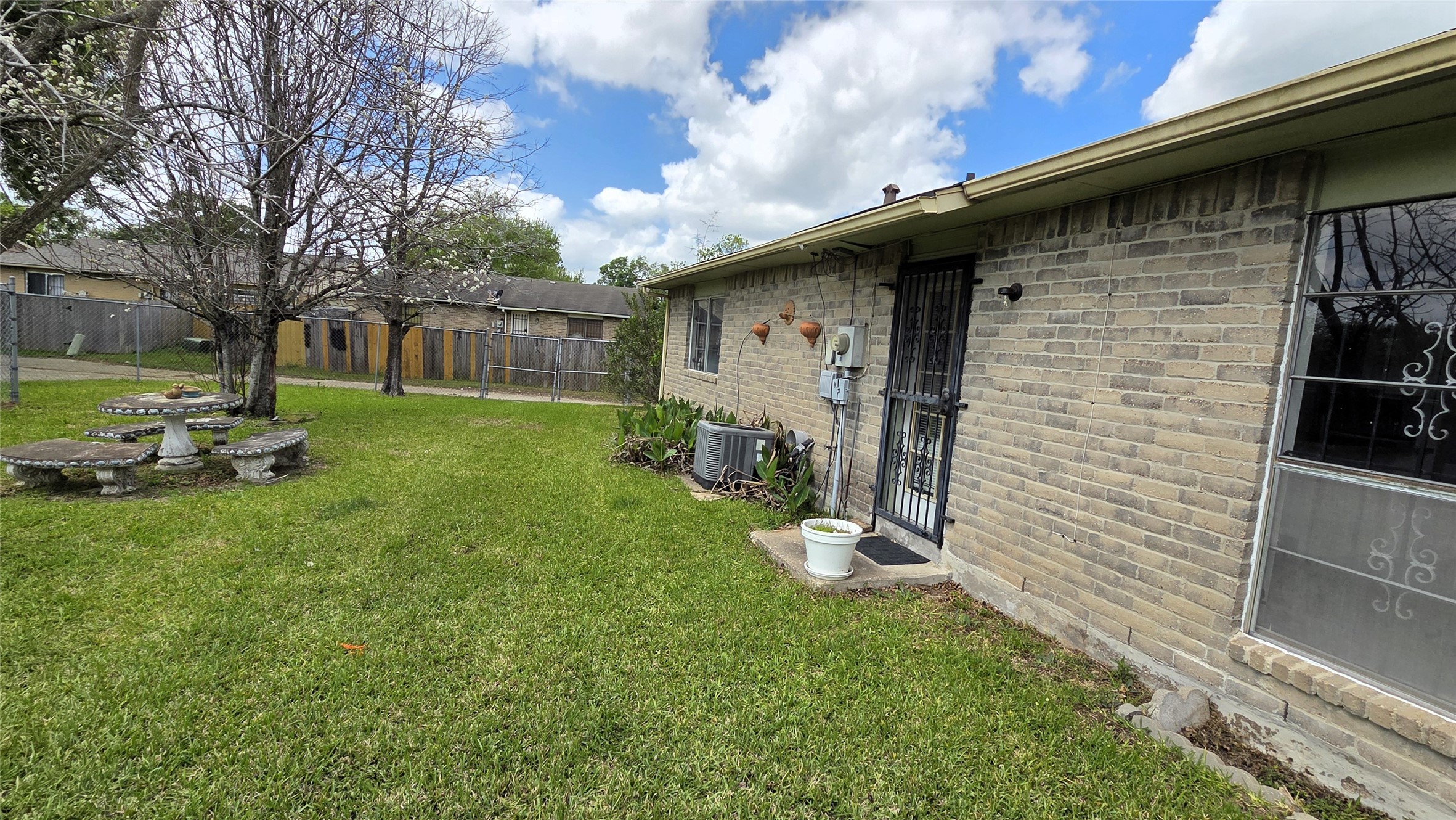 14110 Pinewest Drive Houston, TX 77049 - Photo 4 of 26 a view of a backyard with a large tree