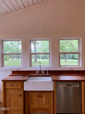 a kitchen with a sink and a window