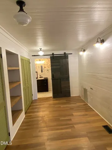 a view of empty room with a fireplace