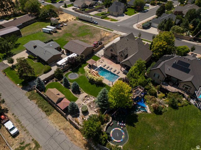 687 South 2080th Street East Springville, UT 84663 - Photo 77 of 149 Expansive property featuring a large backyard with a swimming pool, adjacent patio area, and a shaded pergola
