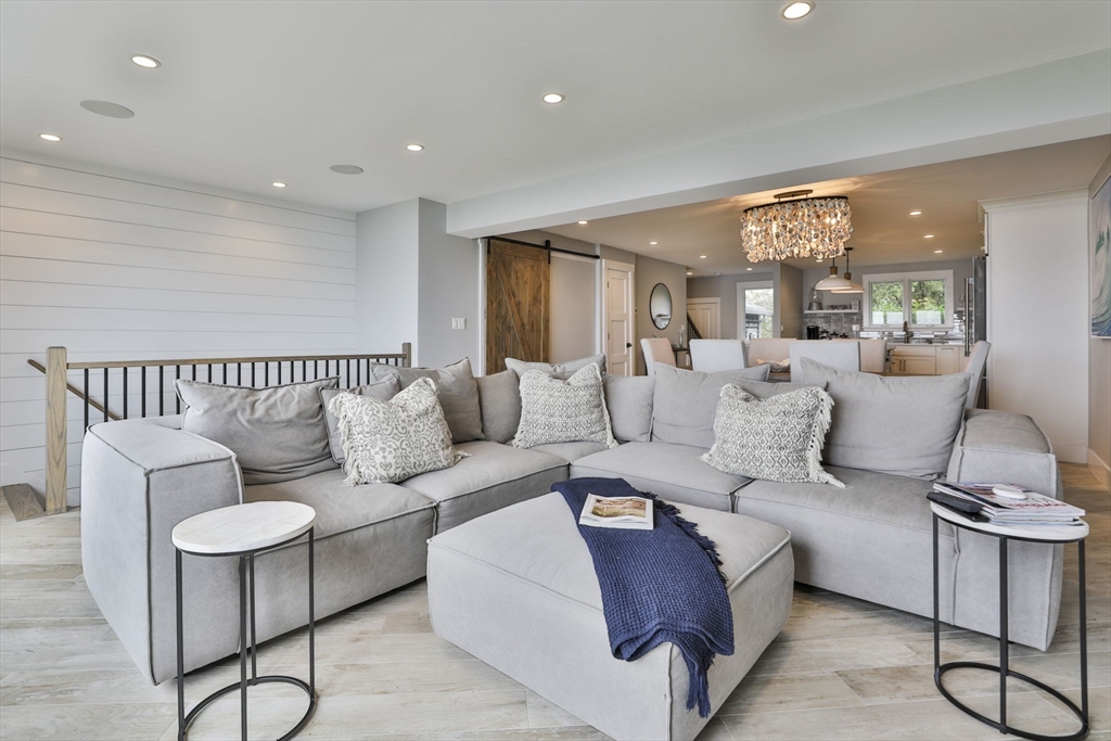 45 Raymond Street, Unit 7 Manchester, MA 01944 - Photo 11 of 40 a living room with furniture and a large window