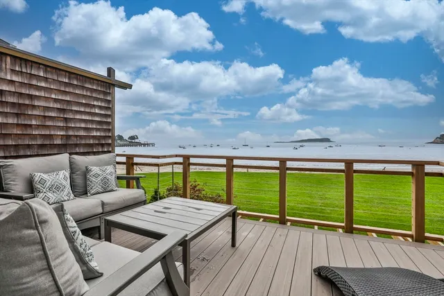 a view of a balcony with a table and chairs