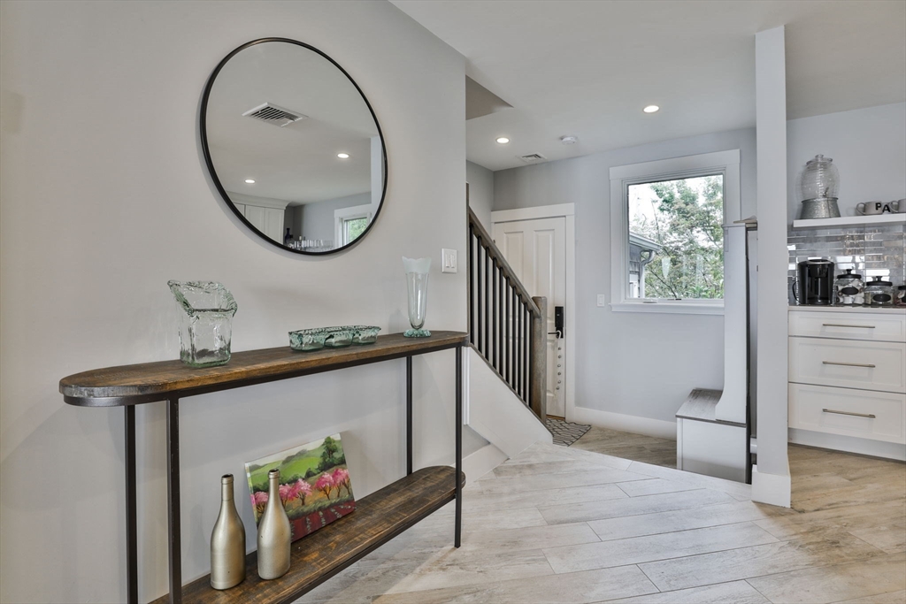 45 Raymond Street, Unit 7 Manchester, MA 01944 - Photo 17 of 40 a view of a hallway with wooden floor and entryway