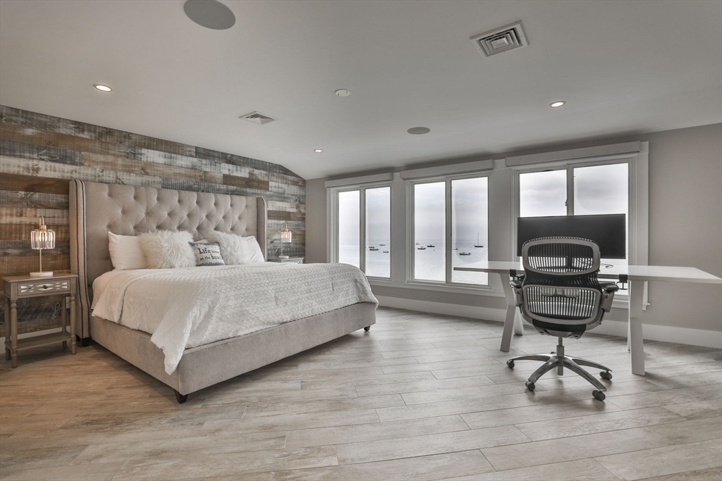 45 Raymond Street, Unit 7 Manchester, MA 01944 - Photo 18 of 40 a bedroom with a bed and a desk