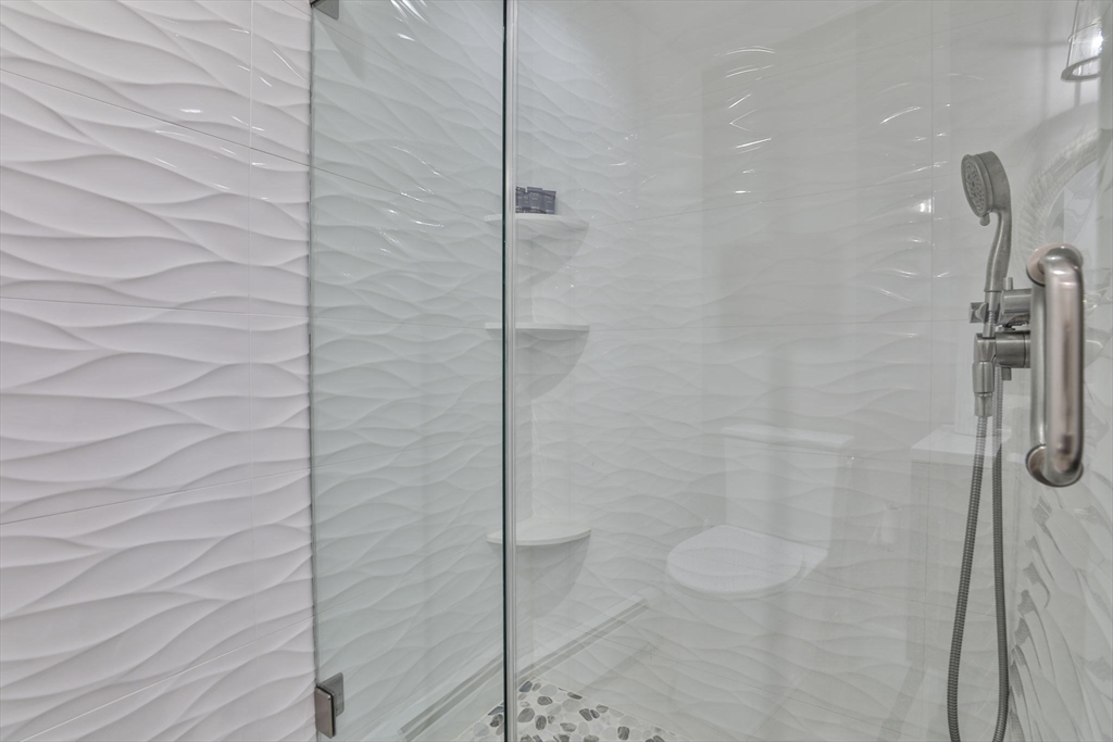 45 Raymond Street, Unit 7 Manchester, MA 01944 - Photo 22 of 40 a bathroom with a shower