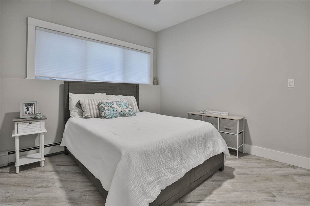 45 Raymond Street, Unit 7 Manchester, MA 01944 - Photo 25 of 40 a bedroom with a bed and window