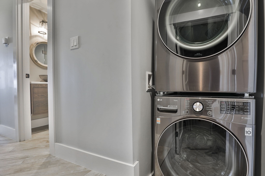 45 Raymond Street, Unit 7 Manchester, MA 01944 - Photo 27 of 40 a utility room with dryer and washer