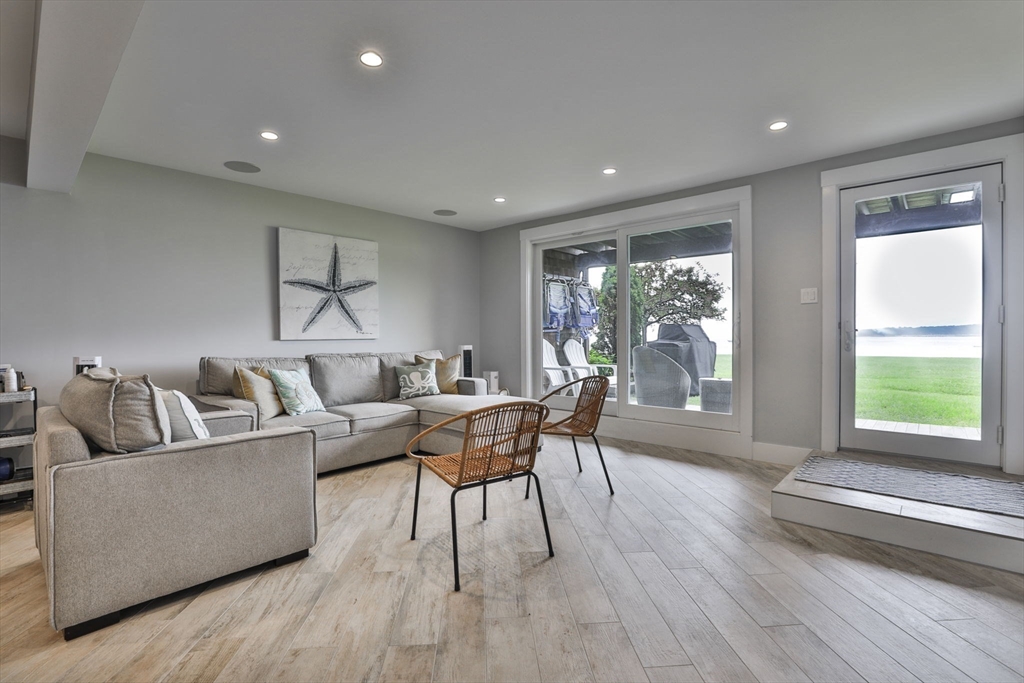 45 Raymond Street, Unit 7 Manchester, MA 01944 - Photo 28 of 40 a living room with furniture and a large window