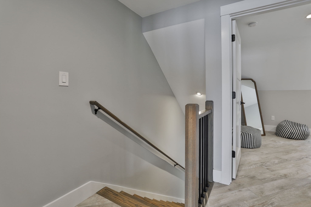 45 Raymond Street, Unit 7 Manchester, MA 01944 - Photo 29 of 40 a view of a livingroom with a bench