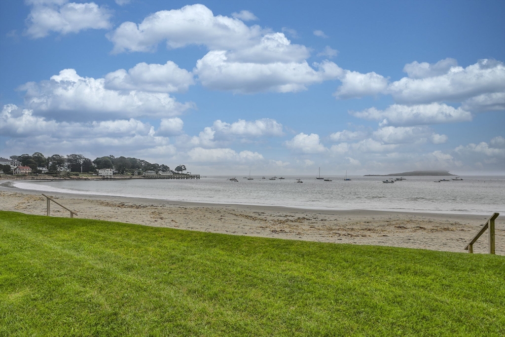 45 Raymond Street, Unit 7 Manchester, MA 01944 - Photo 33 of 40 a view of a lake with a big yard