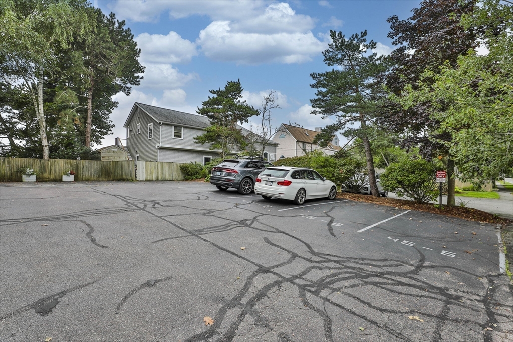45 Raymond Street, Unit 7 Manchester, MA 01944 - Photo 40 of 40 a car parked in front of a house