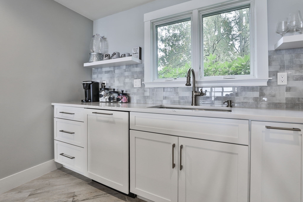 45 Raymond Street, Unit 7 Manchester, MA 01944 - Photo 6 of 40 a kitchen with white cabinets and window