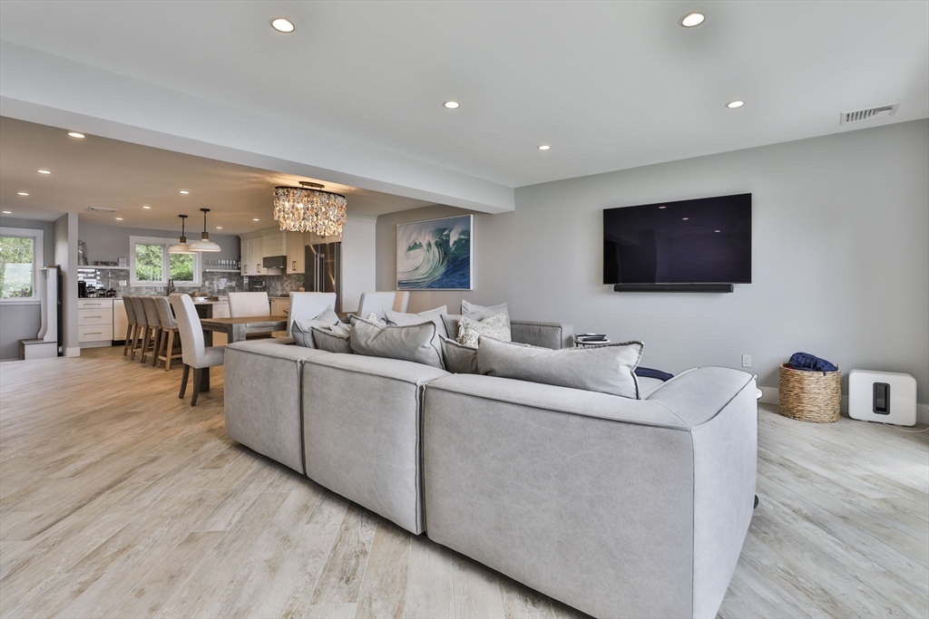 45 Raymond Street, Unit 7 Manchester, MA 01944 - Photo 10 of 40 a living room with furniture and a flat screen tv