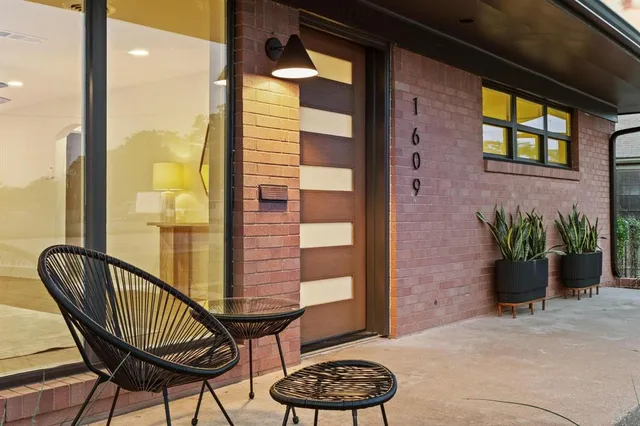 a balcony view with a seating space