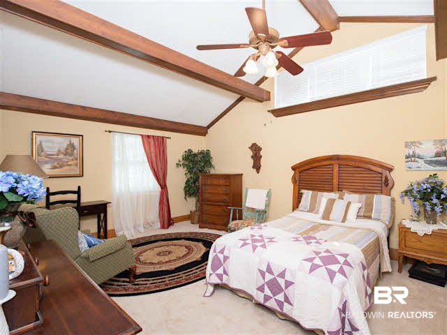 640 Spanish Main Spanish Fort, AL 36527 - Photo 19 of 33 Upstairs master with tall ceilings, lots of windows and exposed beams.