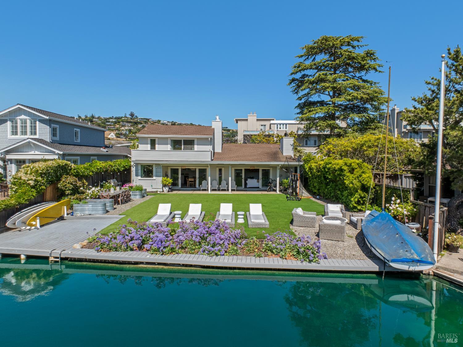 a view of an chairs and table in the garden