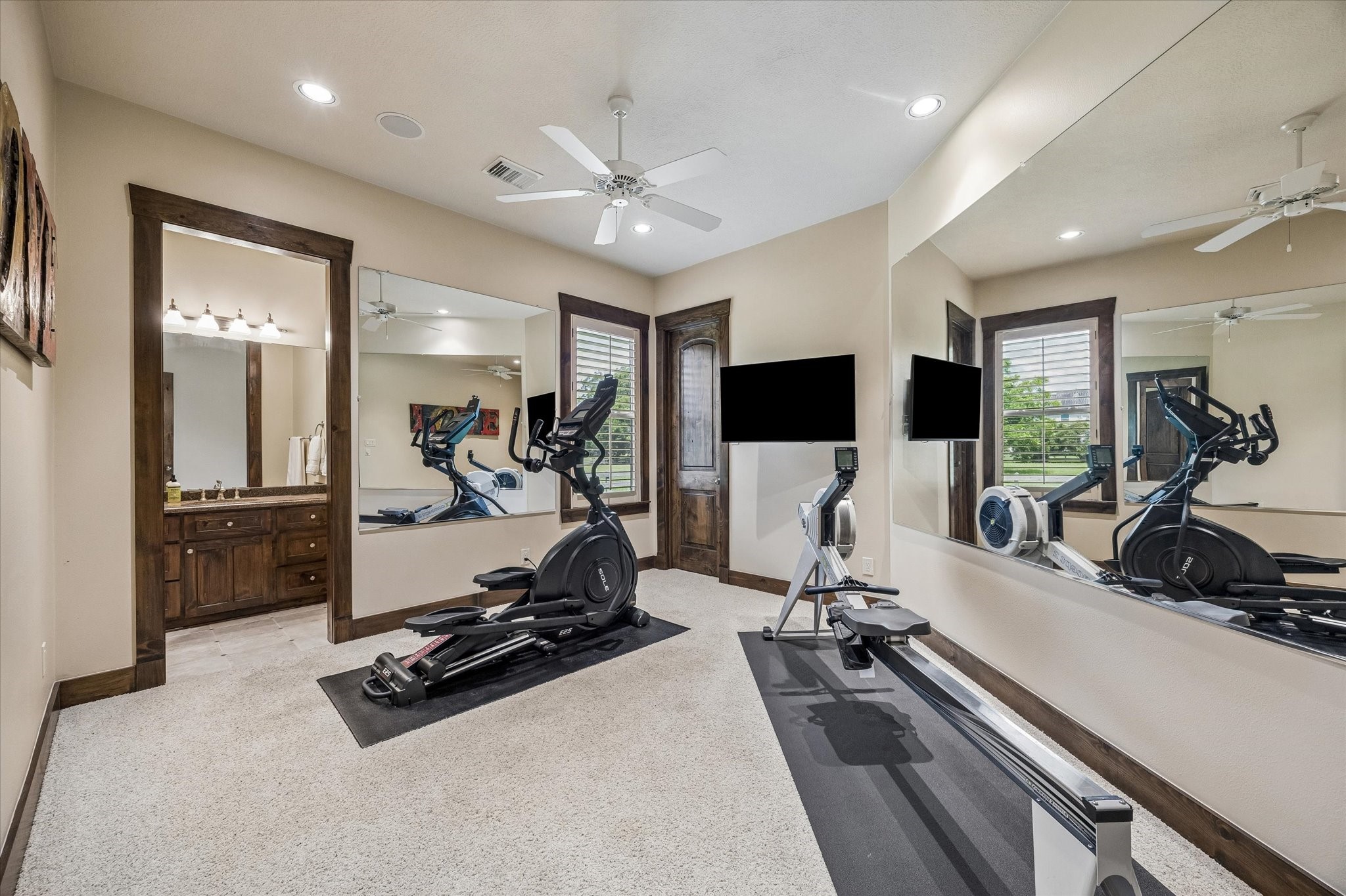 32102 Fulbrook Commons Fulshear, TX 77441 - Photo 25 of 50 This versatile downstairs bedroom with jack and jill bathroom can easily be transformed to accommodate a home gym, hobby room, media space, or additional living area to suit your needs.