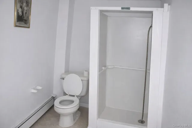 a white toilet sitting next to a bathroom sink