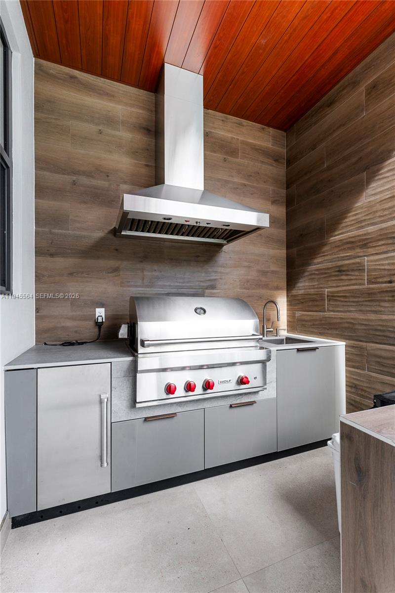 12911 Oleander Road North Miami, FL 33181 - Photo 17 of 67 a stove top oven sitting inside of a kitchen