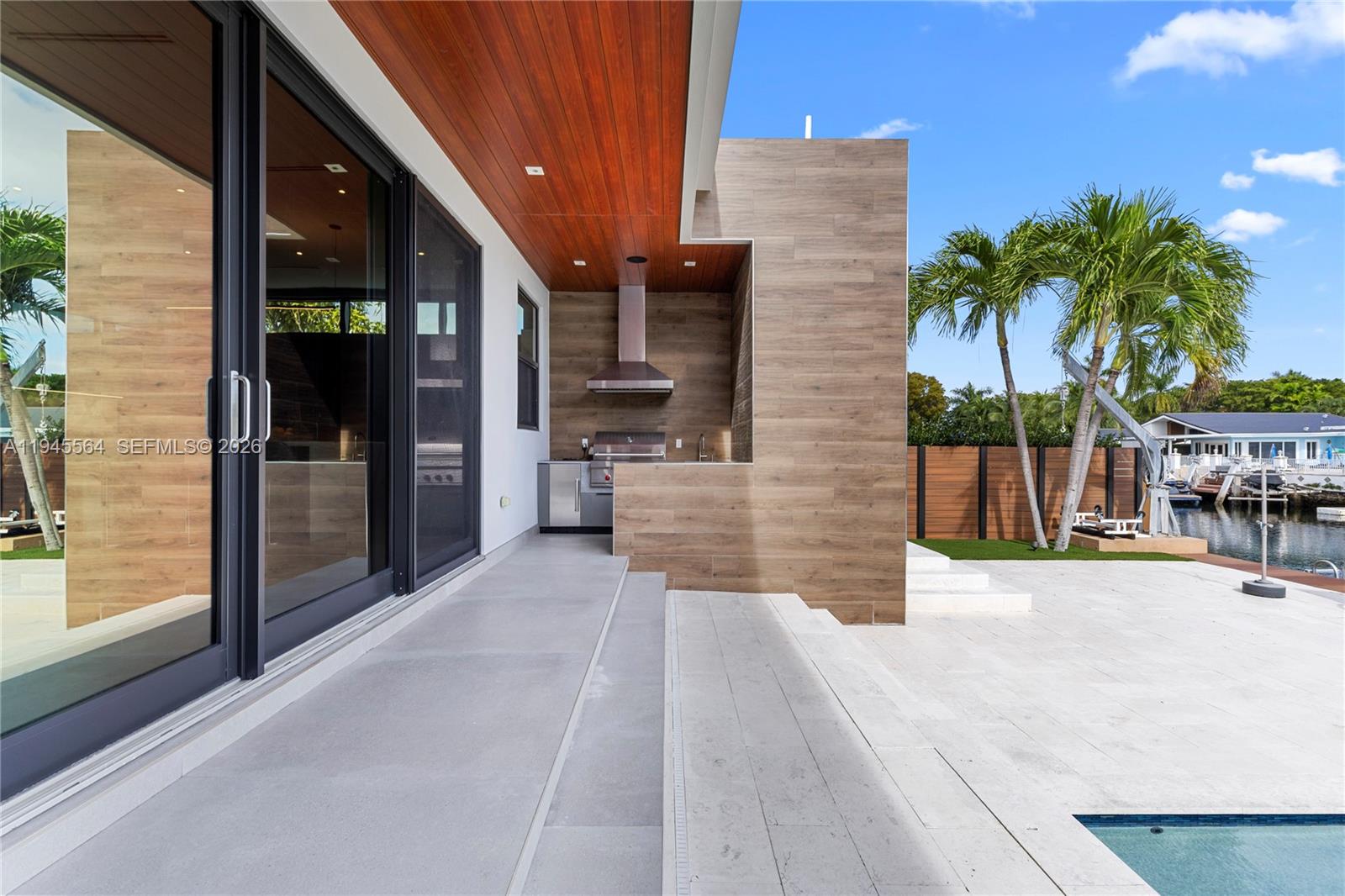 12911 Oleander Road North Miami, FL 33181 - Photo 18 of 67 a view of a backyard with a patio