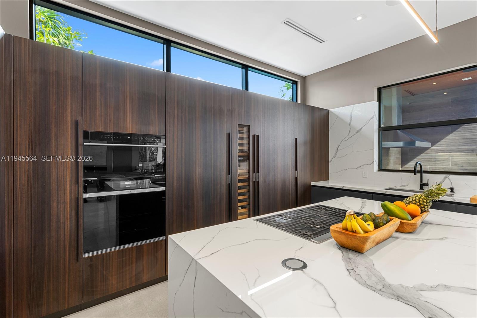 12911 Oleander Road North Miami, FL 33181 - Photo 23 of 67 a kitchen with stainless steel appliances kitchen island granite countertop a refrigerator and a stove