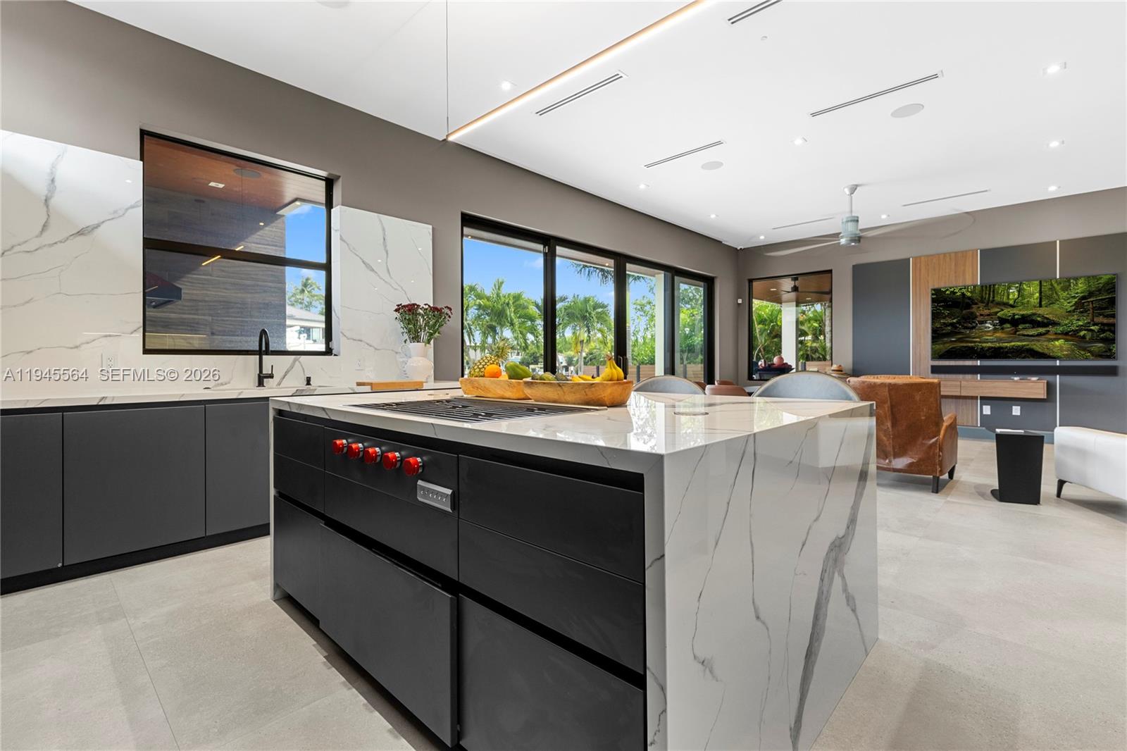 12911 Oleander Road North Miami, FL 33181 - Photo 24 of 67 a kitchen with a sink and large windows