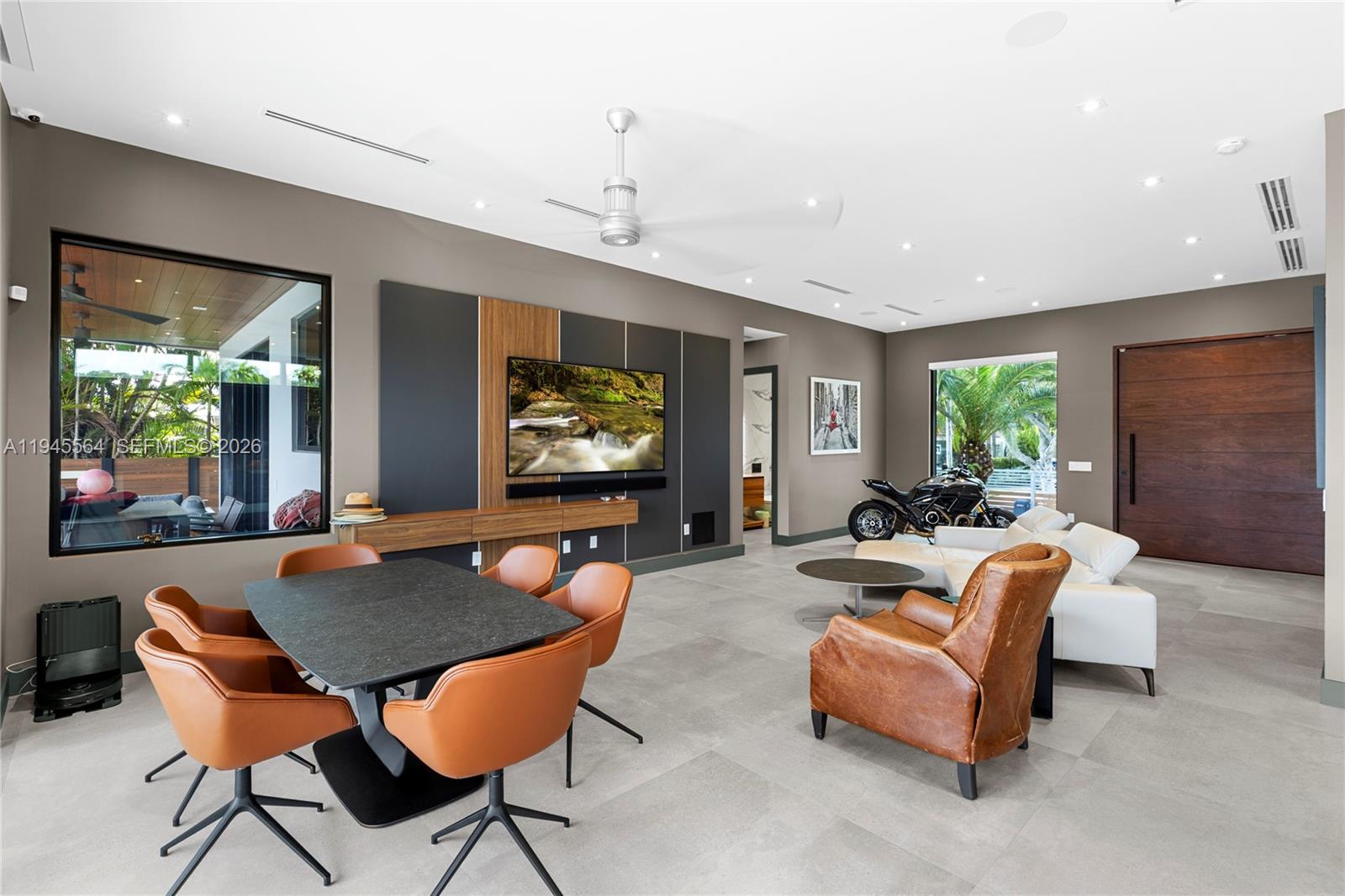 12911 Oleander Road North Miami, FL 33181 - Photo 26 of 67 a living room with furniture and a flat screen tv