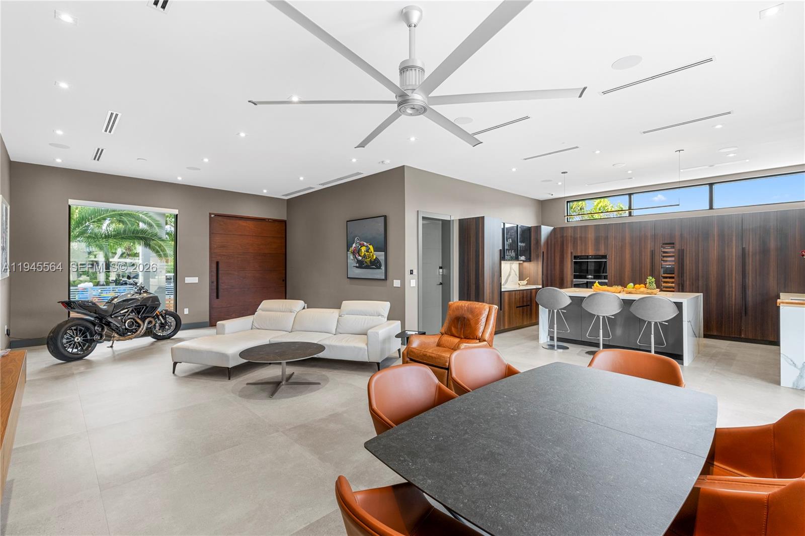 12911 Oleander Road North Miami, FL 33181 - Photo 27 of 67 a living room with furniture kitchen view and a large window