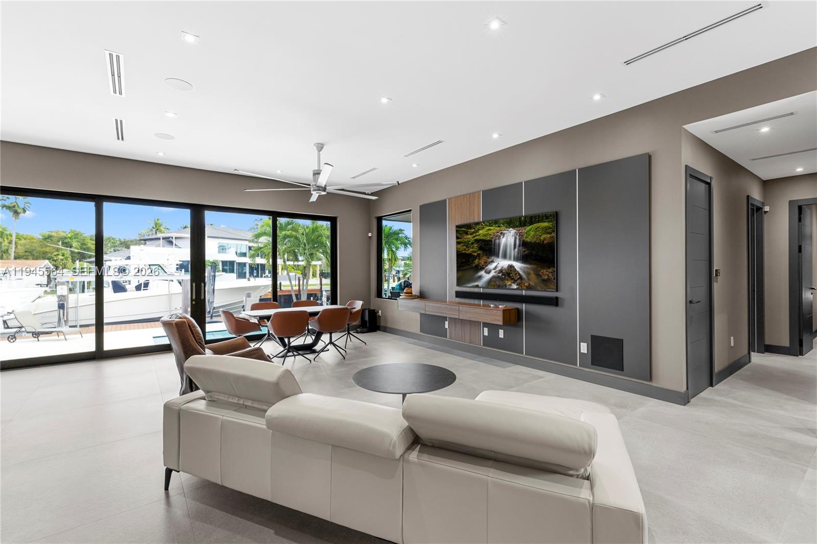 12911 Oleander Road North Miami, FL 33181 - Photo 29 of 67 a living room with furniture and a flat screen tv