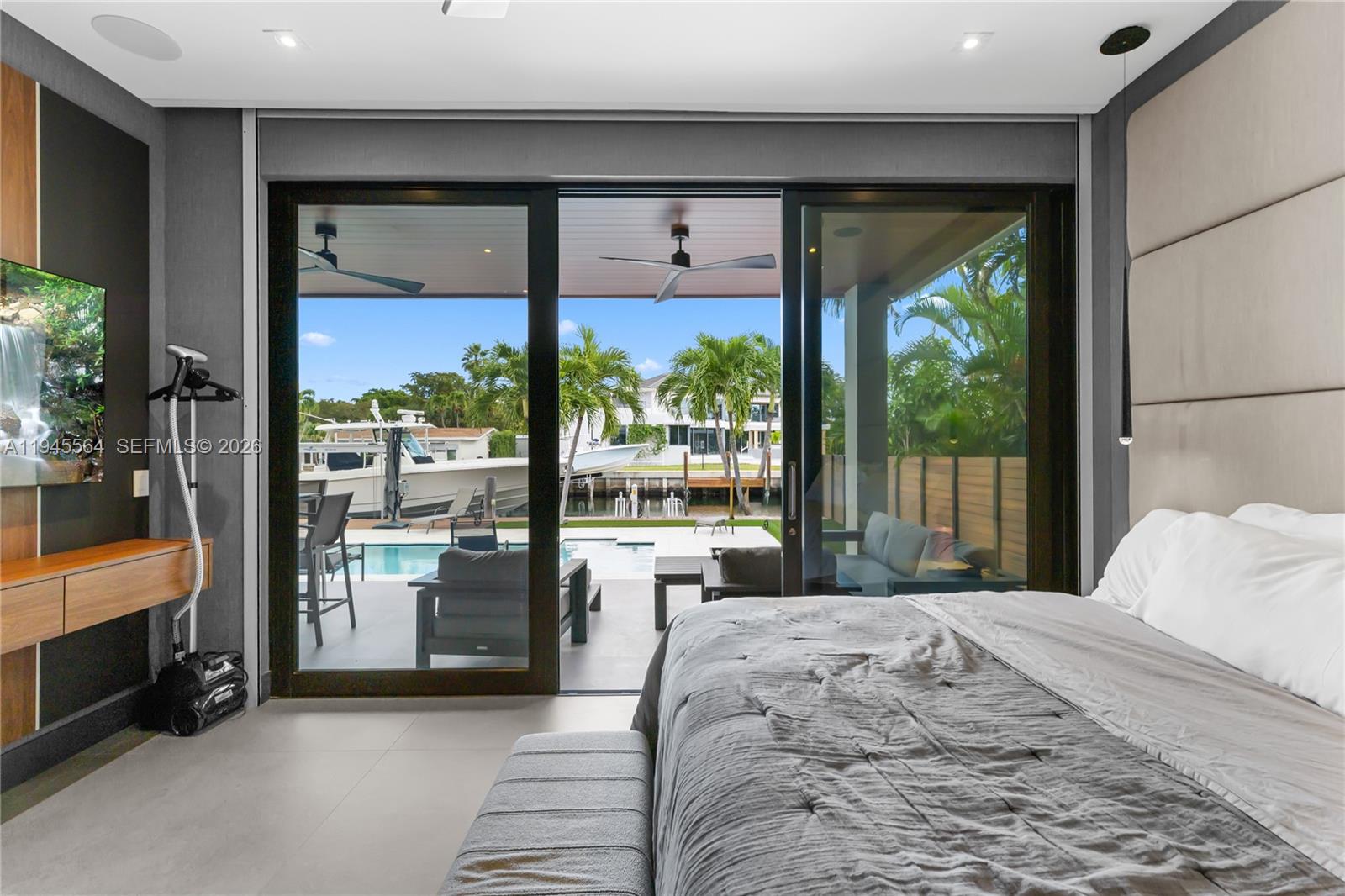 12911 Oleander Road North Miami, FL 33181 - Photo 35 of 67 a bedroom with a large bed and a large window