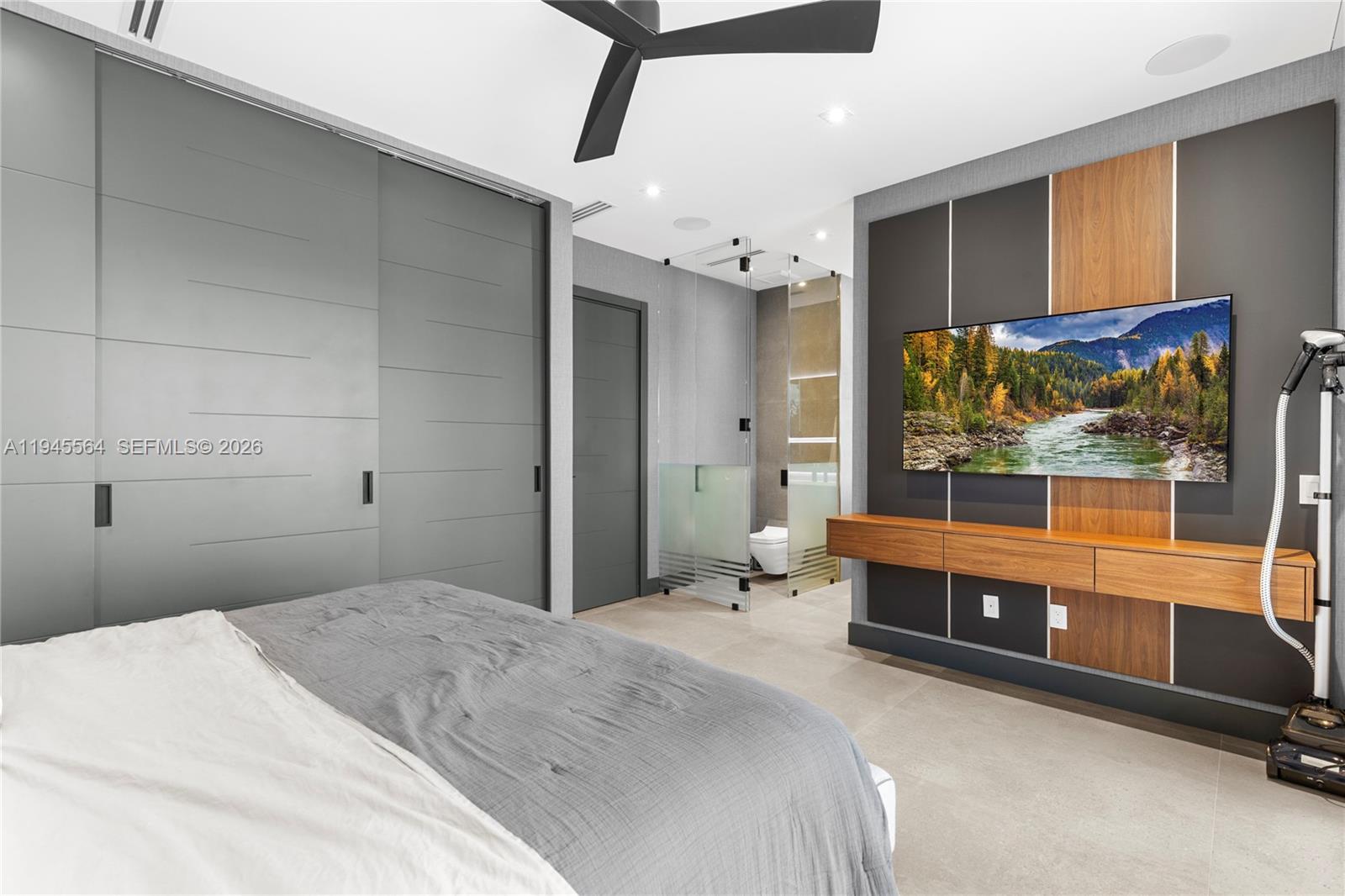 12911 Oleander Road North Miami, FL 33181 - Photo 36 of 67 a bedroom with a bed and a large window