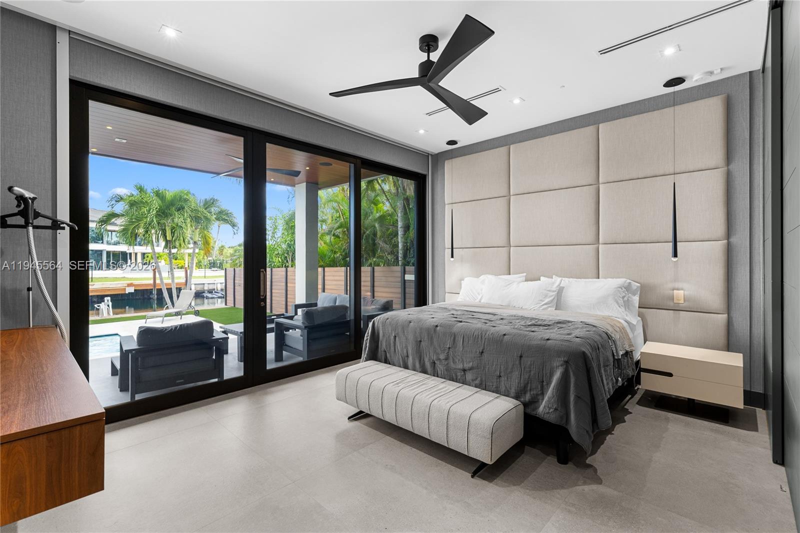 12911 Oleander Road North Miami, FL 33181 - Photo 37 of 67 a bedroom with a bed couch and window