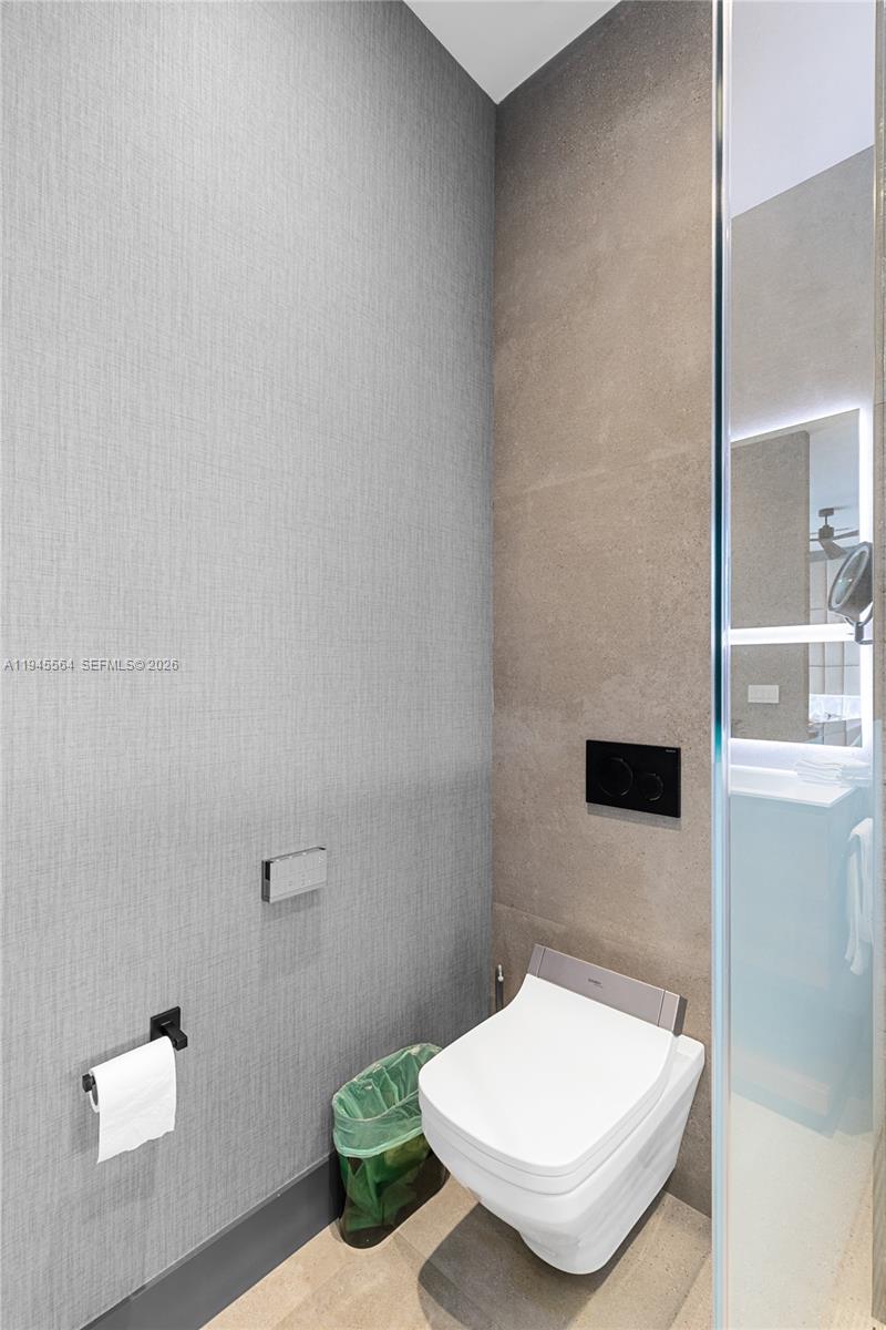 12911 Oleander Road North Miami, FL 33181 - Photo 43 of 67 a bathroom with a toilet and a sink