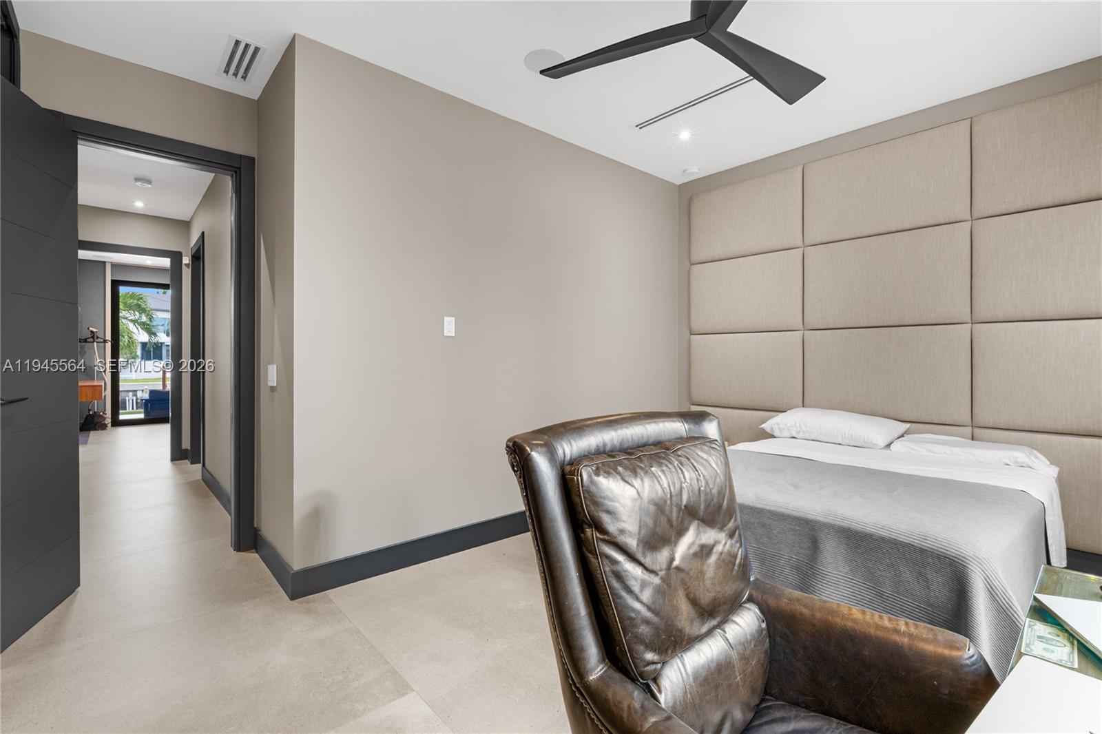 12911 Oleander Road North Miami, FL 33181 - Photo 46 of 67 a bedroom with a bed and a chandelier