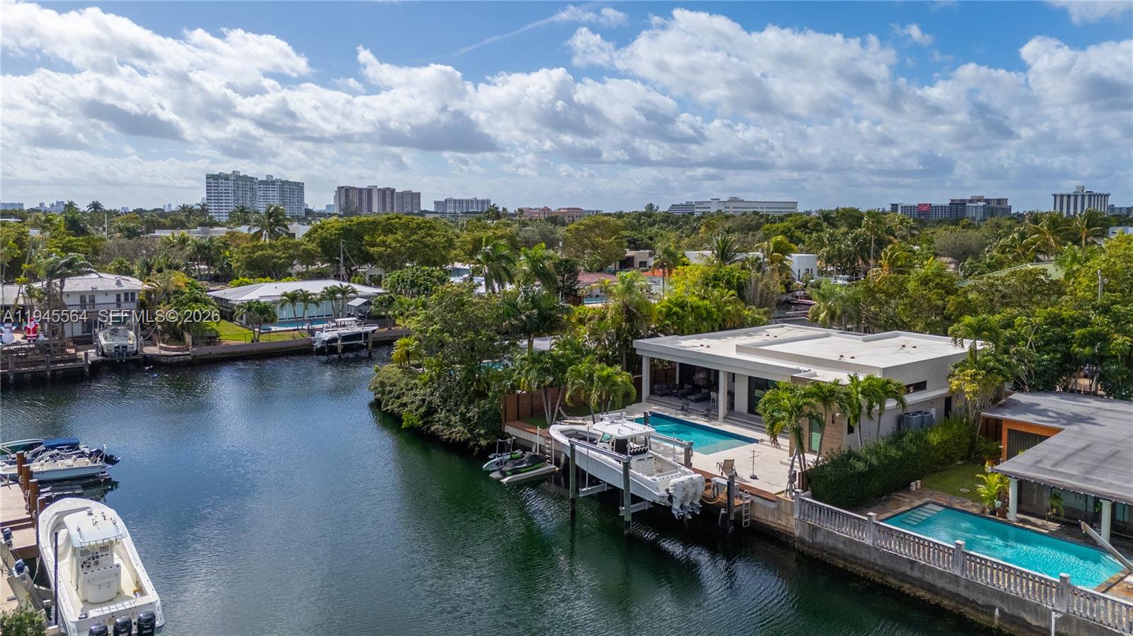 12911 Oleander Road North Miami, FL 33181 - Photo 57 of 67 a view of house with lake view and boat