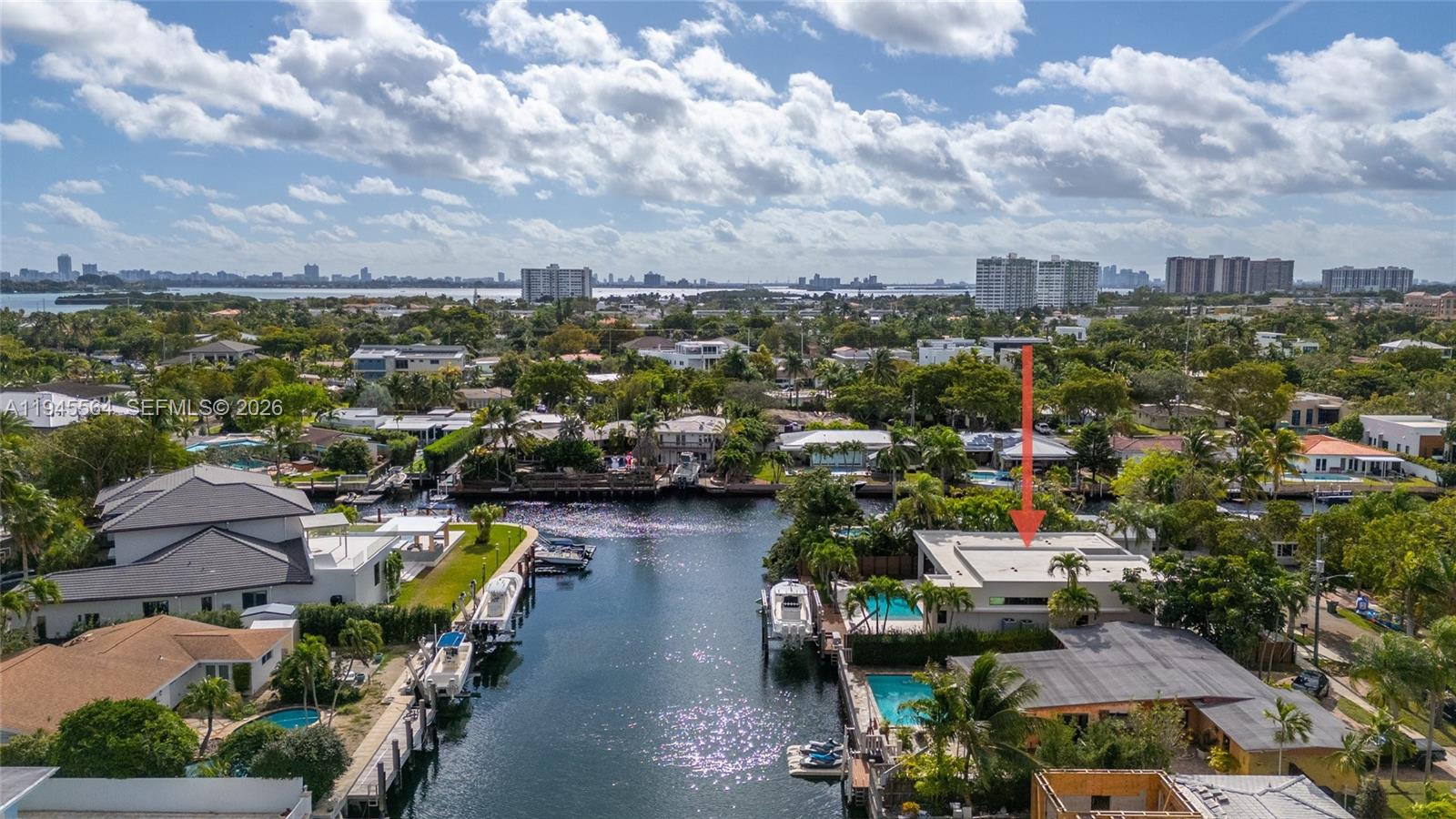 12911 Oleander Road North Miami, FL 33181 - Photo 65 of 67 an aerial view of a city with lots of residential buildings ocean and mountain view in back