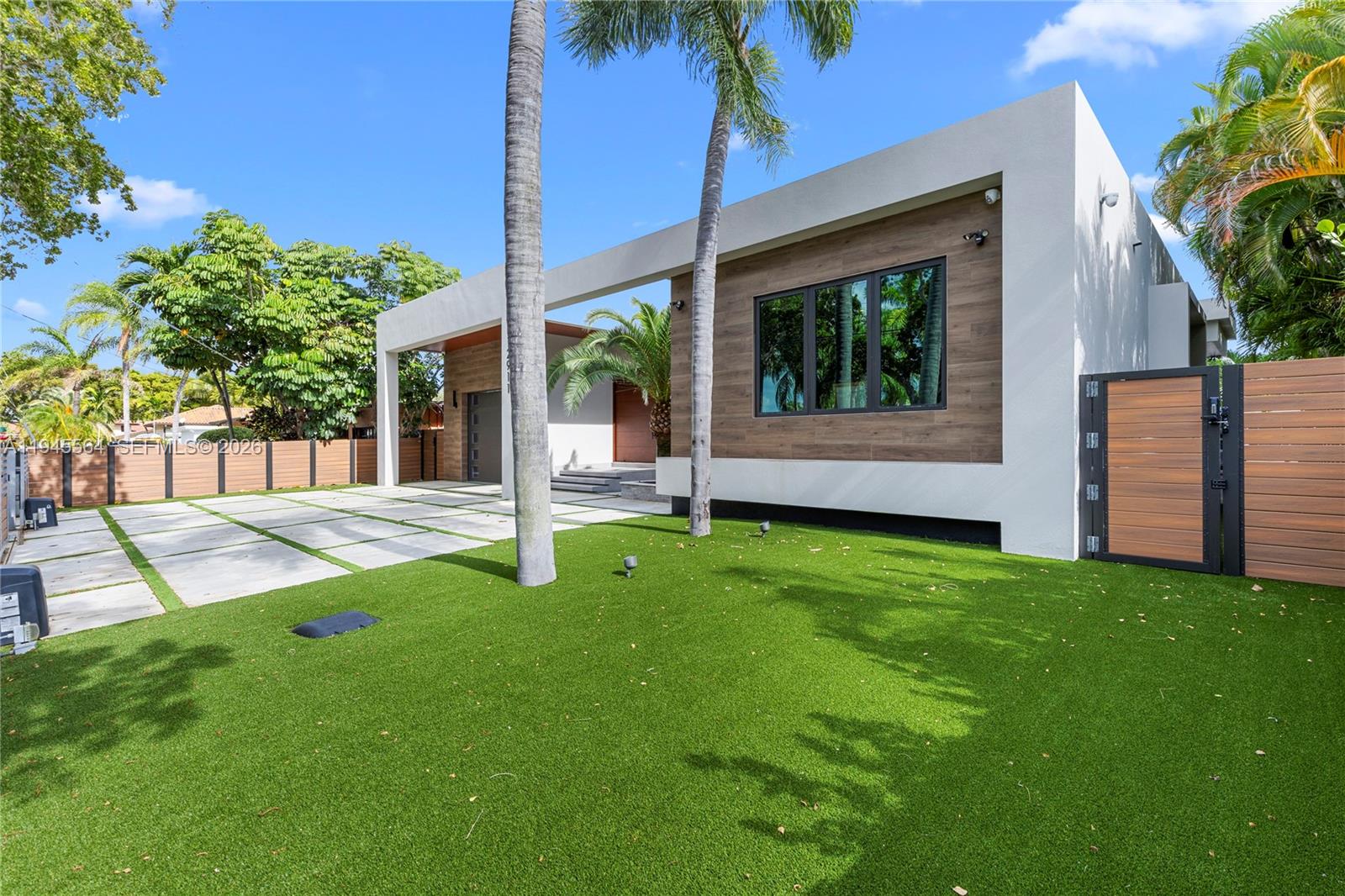 12911 Oleander Road North Miami, FL 33181 - Photo 7 of 67 a view of a backyard with a garden