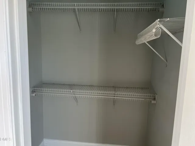 a view of a room with racks on the wall