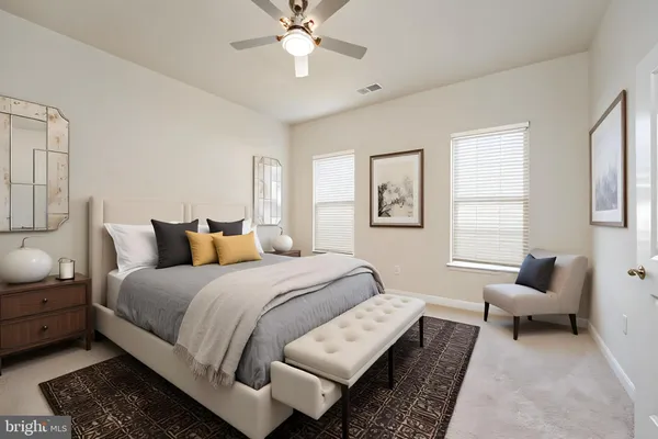 a bedroom with bed and a chandelier