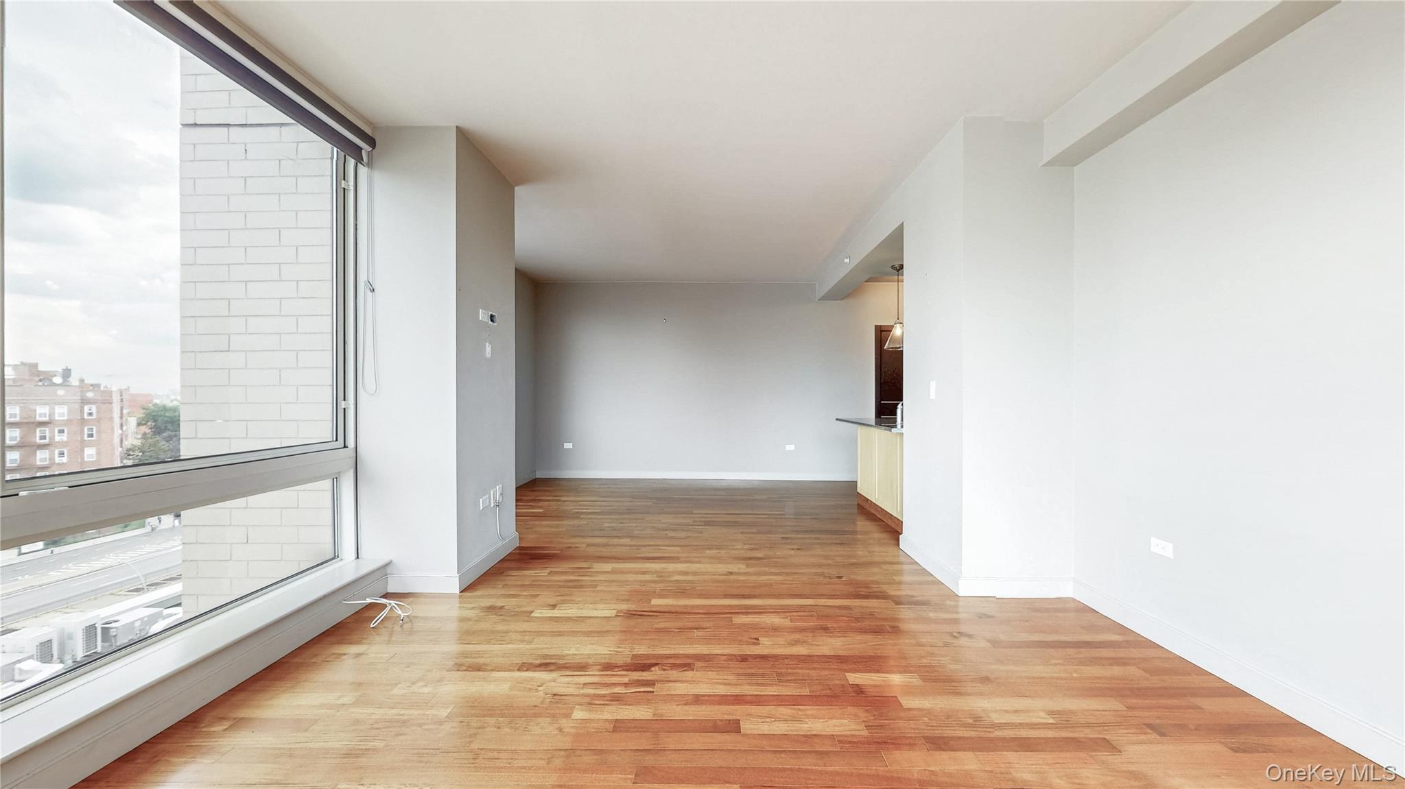 10724 71st Road, Unit 7E Queens, NY 11375 - Photo 9 of 21 Unfurnished room with light wood-type flooring