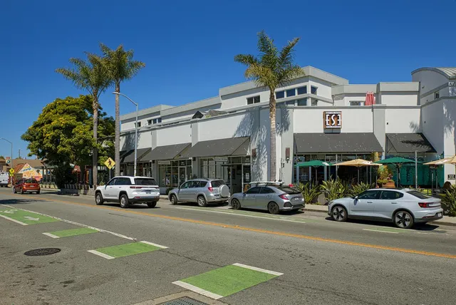 a view of a cars parked in front of a building