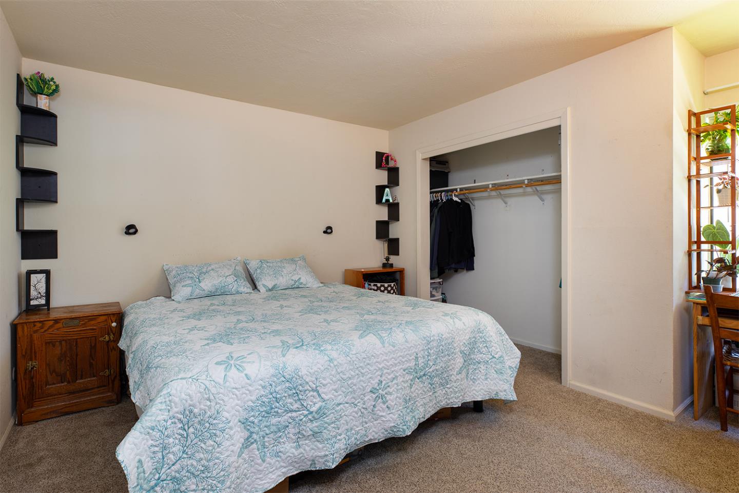 1925 46th Avenue, Unit 121 Capitola, CA 95010 - Photo 9 of 22 a bedroom with a bed and a window