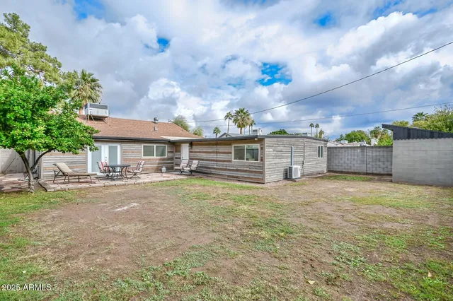 a front view of house with yard and entertaining space