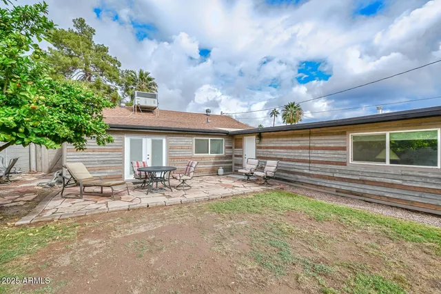 a front view of house with yard and seating space
