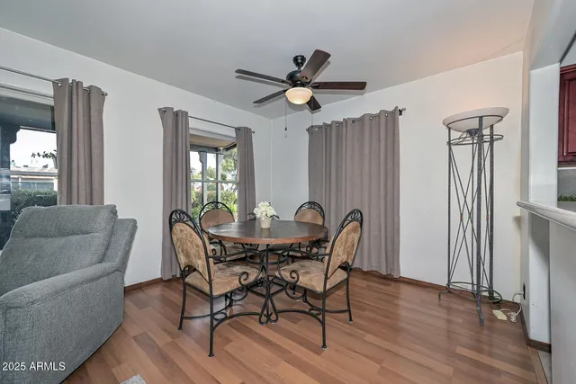 a view of a dining room with furniture and a window