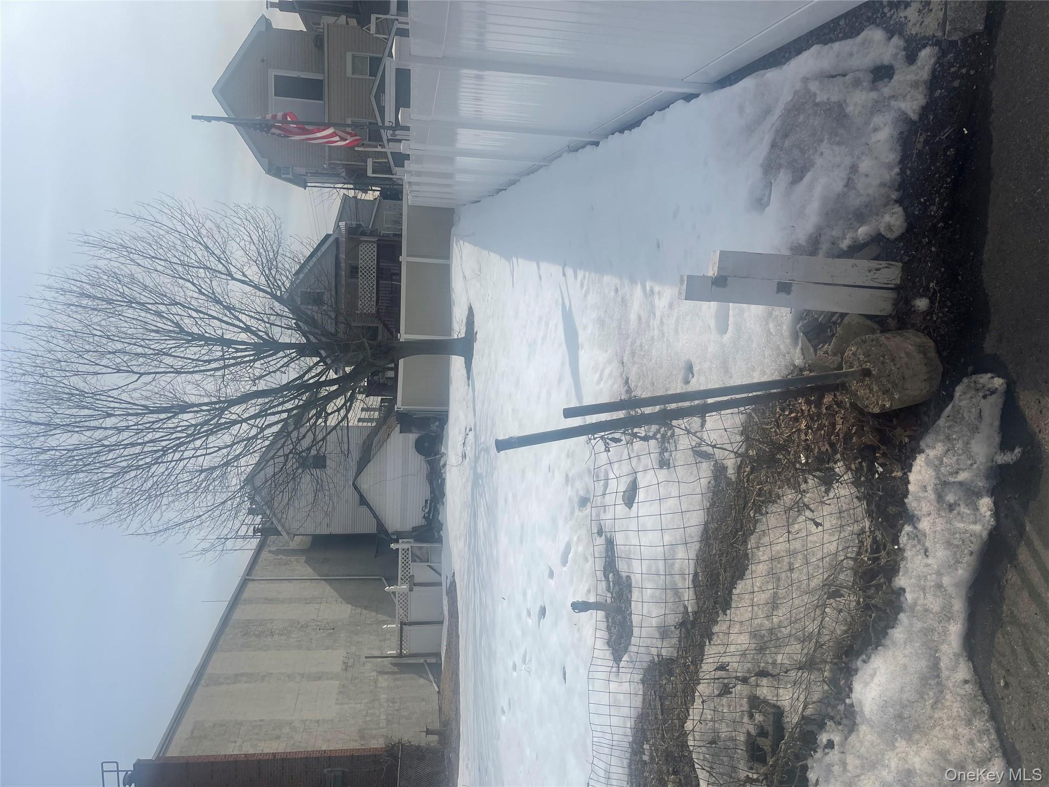 102-32 Rau Court Queens, NY 11414 - Photo 2 of 3 a view of a yard with a fountain